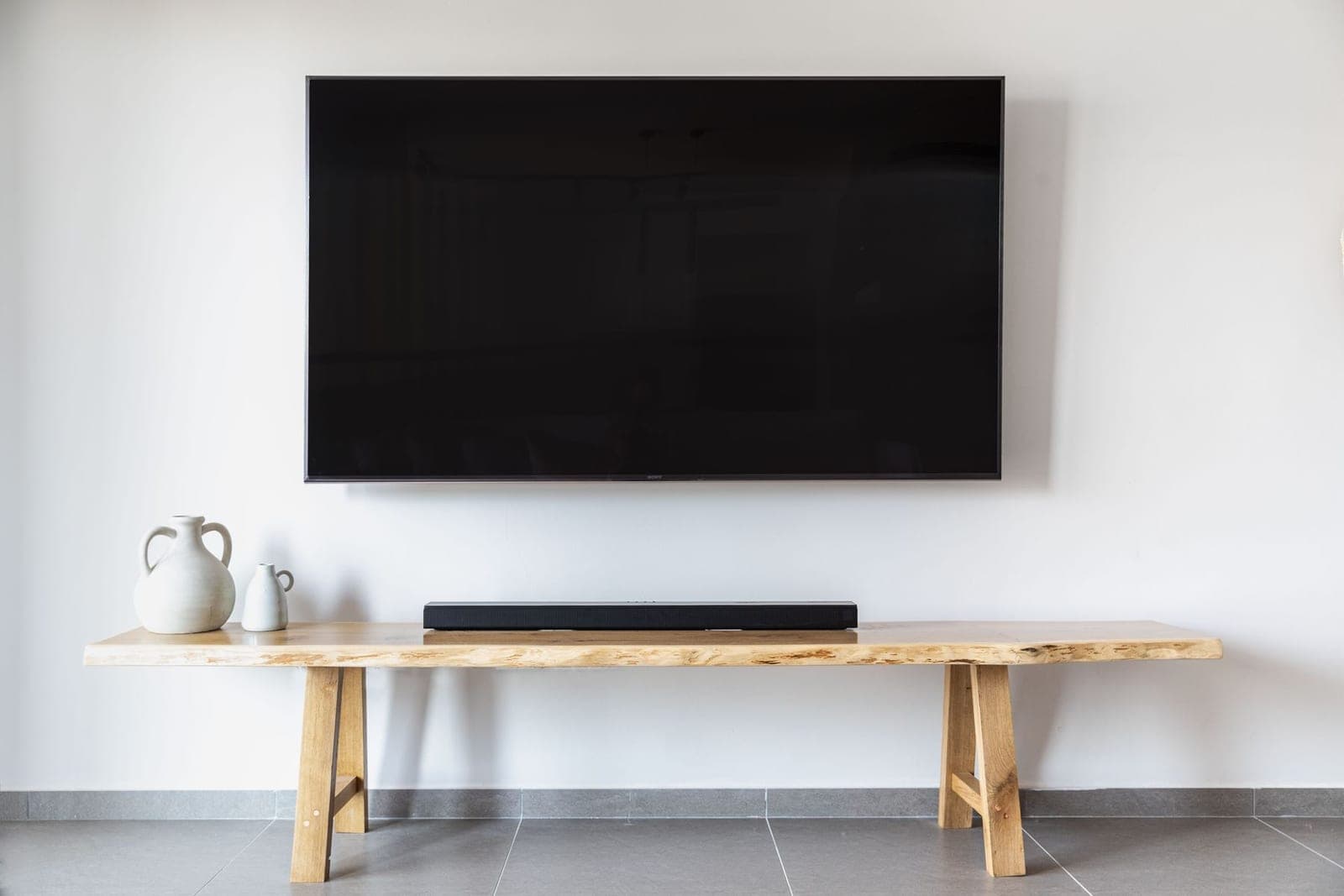 Large TV mounted level on a living room wall in Austin with no visible wires