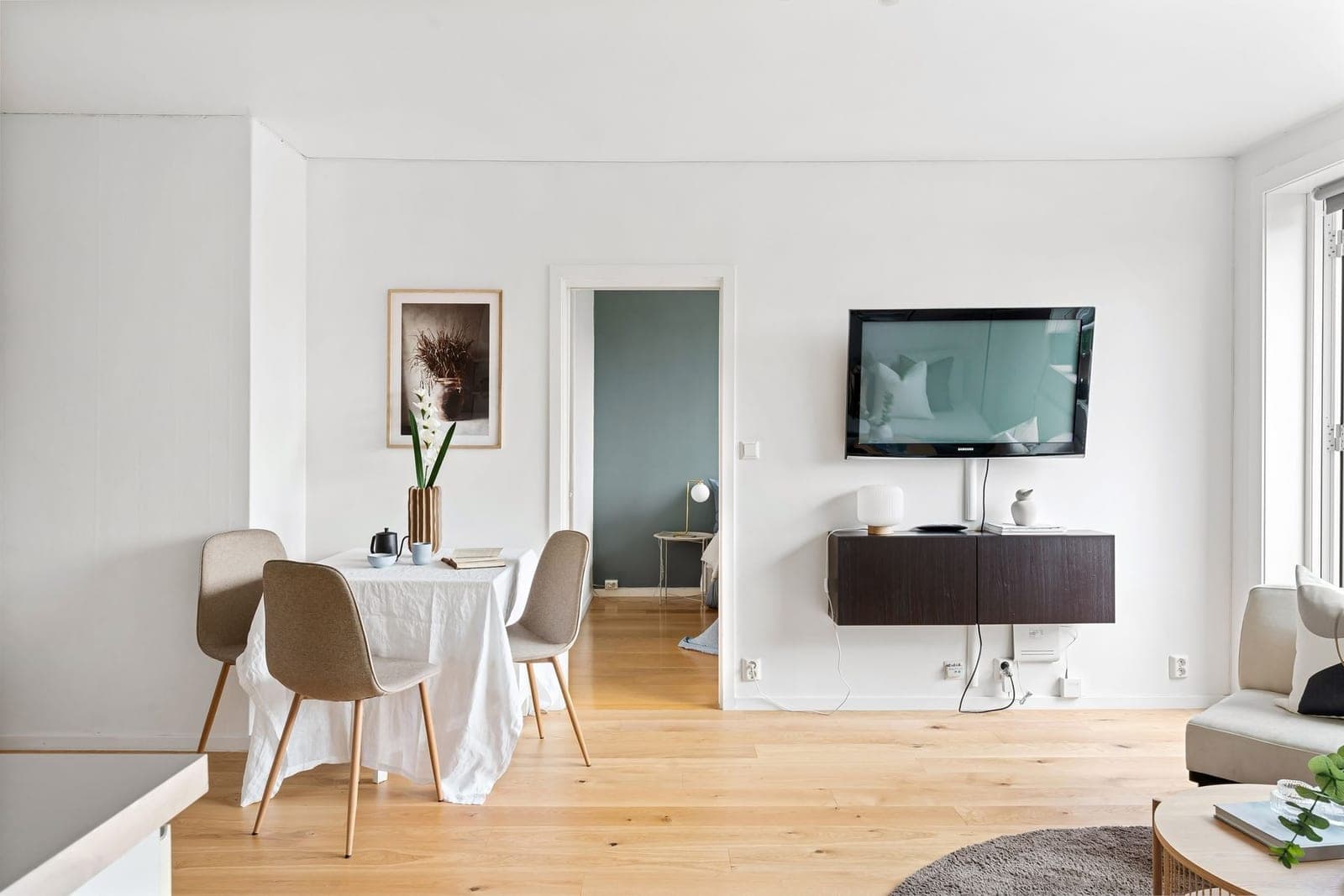 Mounted TV with soundbar and floating shelf in an Austin home